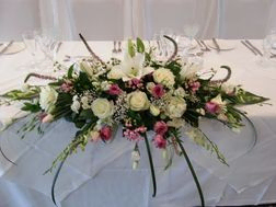 Top table flower arrangement white roses