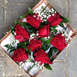 red rose buttonholes for grooms